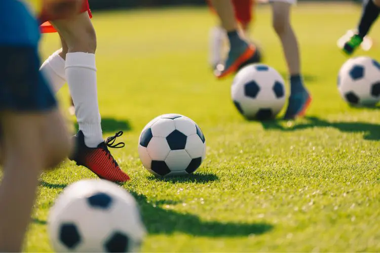 Kids practice their dribbling and ball mastery skills in a small space